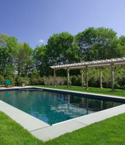 In-ground pool fully landscaped around the outside.