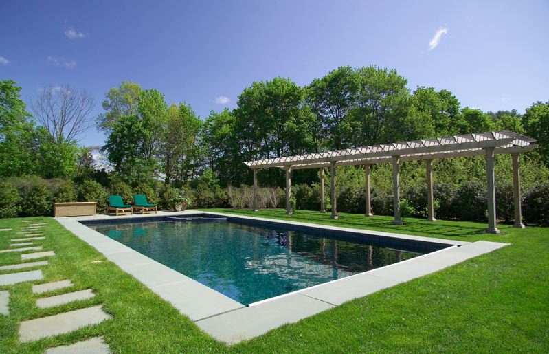 In-ground pool fully landscaped around the outside.